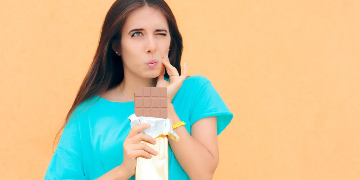 girl feeling tooth pain from dental problems related to sugar consumption girl feeling tooth pain from dental problems related to sugar consumption