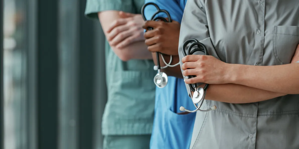 with stethoscope group of doctors are together indoors