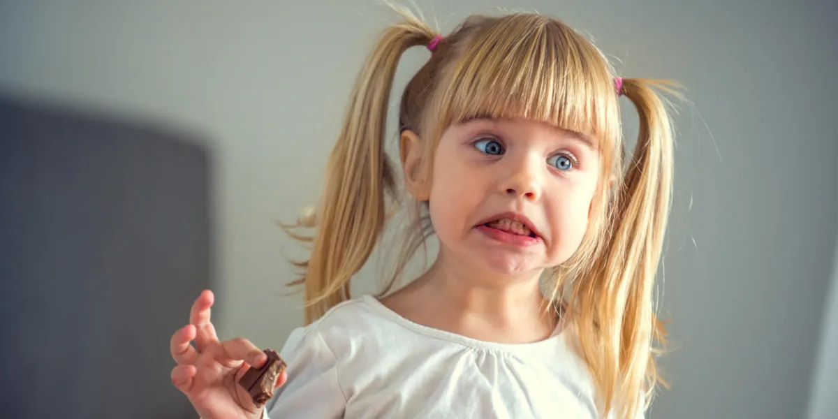 cute little girl eating chocolate cute little girl eating chocolate