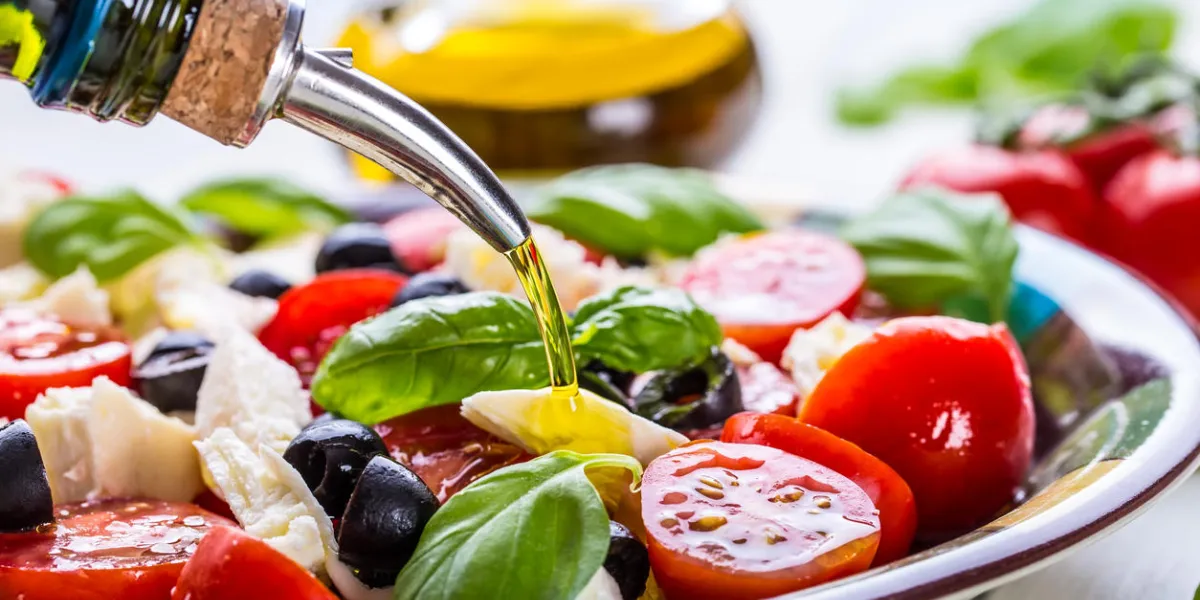 caprese caprese salad italian salad mediterranean salad italian cuisine mediterranean cuisine tomato mozzarella basil leaves black olives and olive oil on wooden table recipe - ingredients caprese caprese salad italian salad mediterranean salad italian cuisine mediterranean cuisine tomato mozzarella basil leaves black olives and olive oil on wooden table recipe - ingredients
