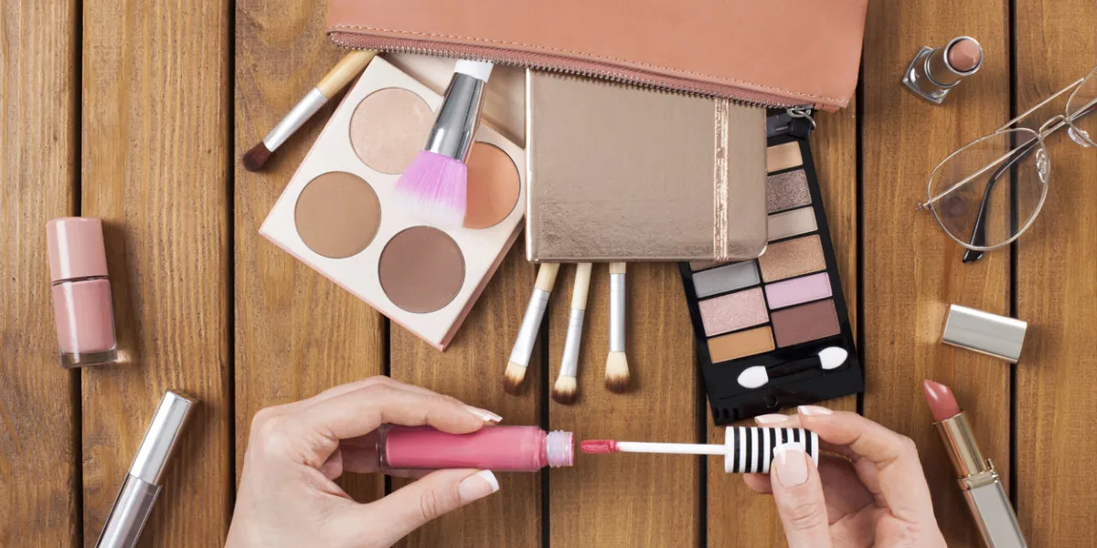 beauty blogger opens her lipstick on dressing tablen beauty blogger opens her lipstick on dressing tablen