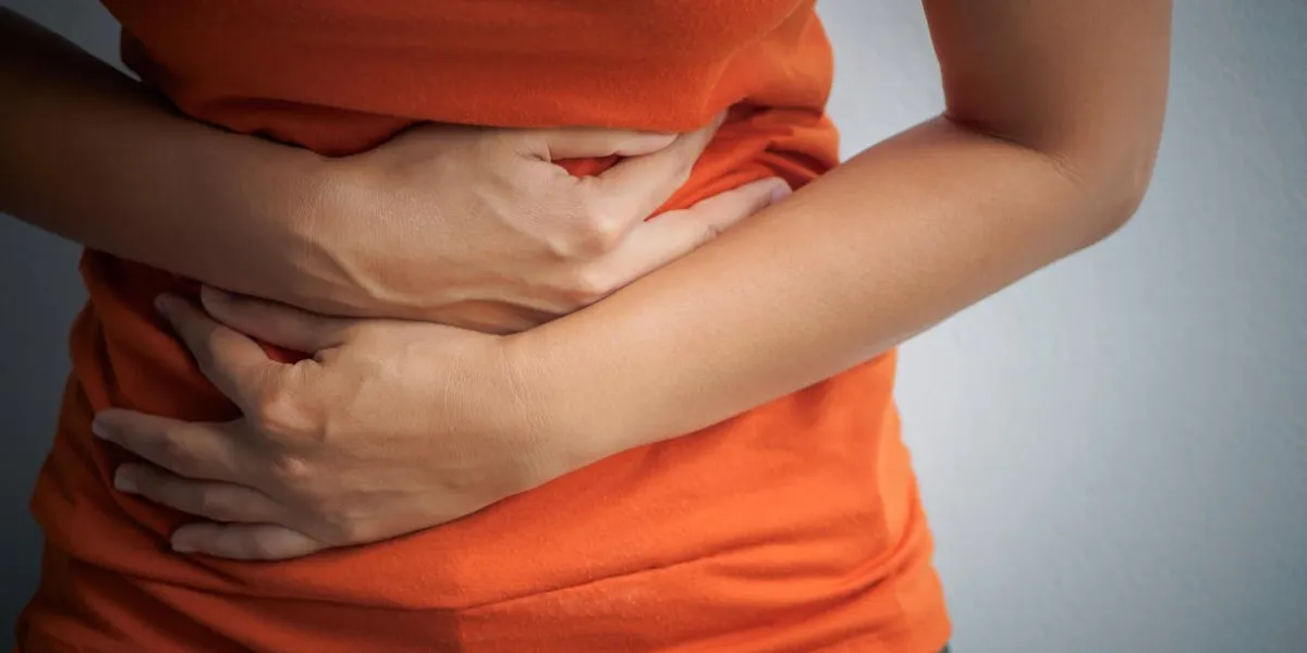 young woman having painful stomachache chronic gastritis abdomen bloating concept young woman having painful stomachache chronic gastritis abdomen bloating concept
