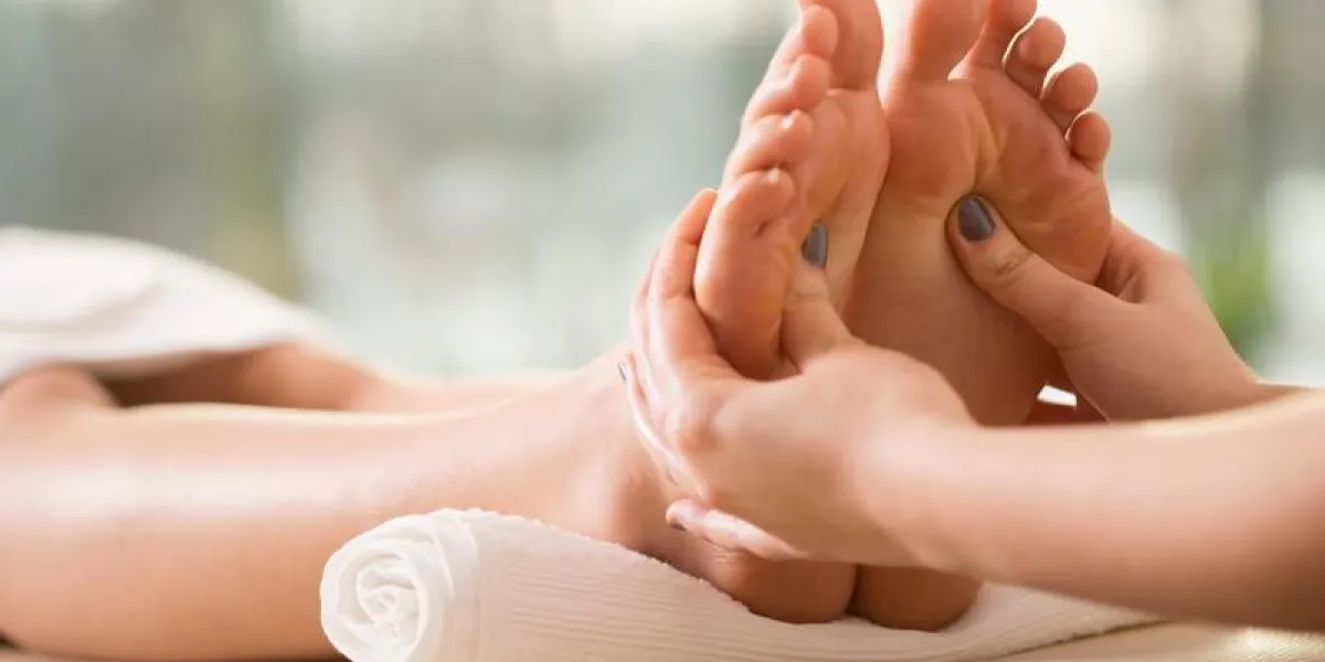 close-up of young woman having reflexology close-up of young woman having reflexology