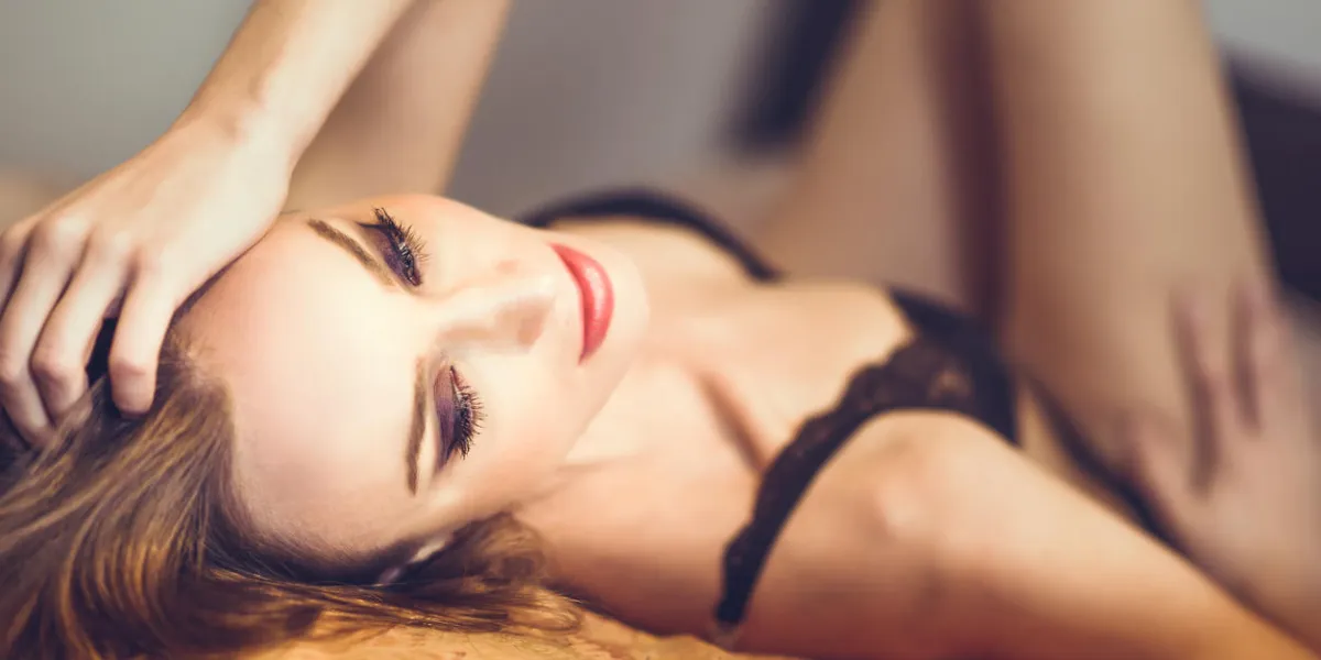 attractive blonde woman in black lingerie posing on her bed young girl wearing underwear with long hair nice make-up with black eyeshadow and red lips attractive blonde woman in black lingerie posing on her bed young girl wearing underwear with long hair nice make-up with black eyeshadow and red lips