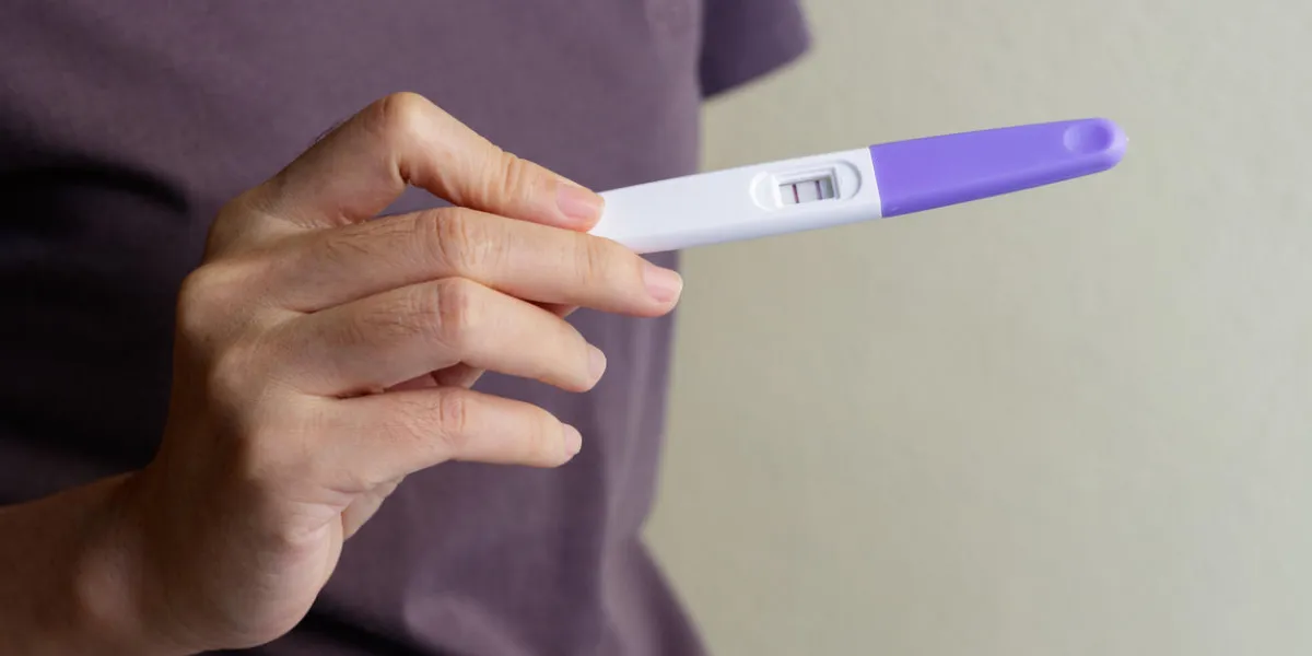 woman holding pregnancy test, new life and family planning concept woman holding pregnancy test, new life and family planning concept