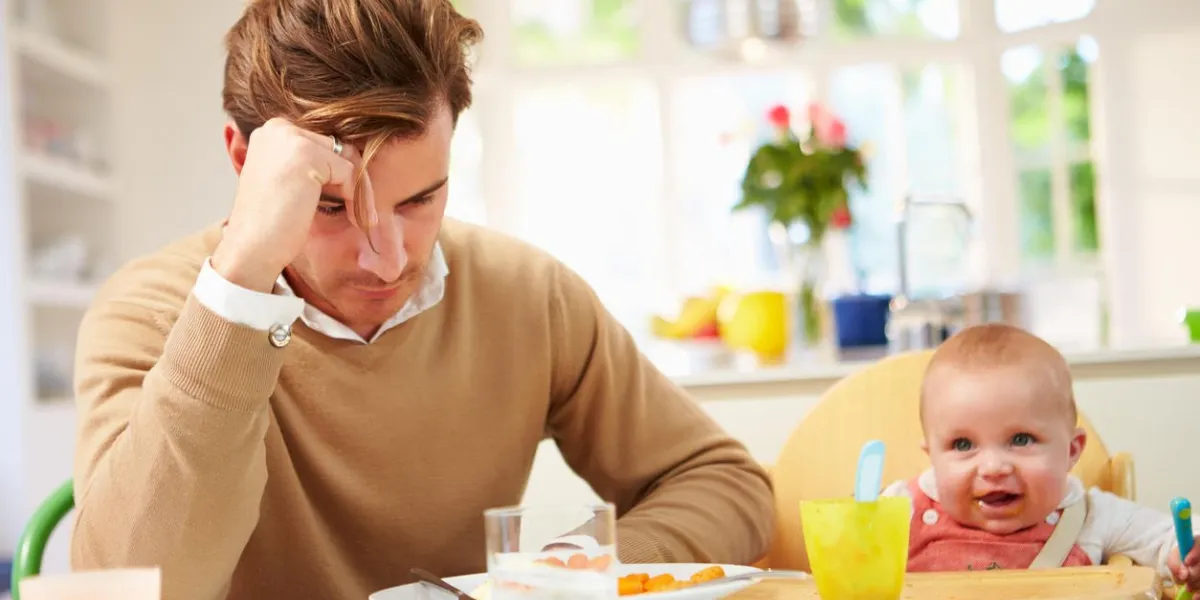 white british father feeling depressed at baby's mealtime white british father feeling depressed at baby's mealtime
