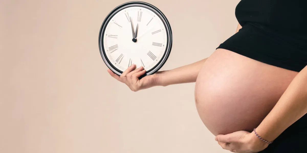 pregnancy concept - counting hours expecting child birth