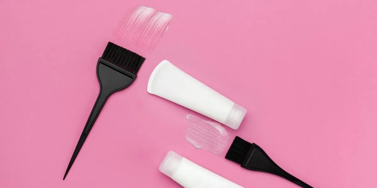 brush for dyeing hair and tube with hair dye top view brush for dyeing hair and tube with hair dye top view
