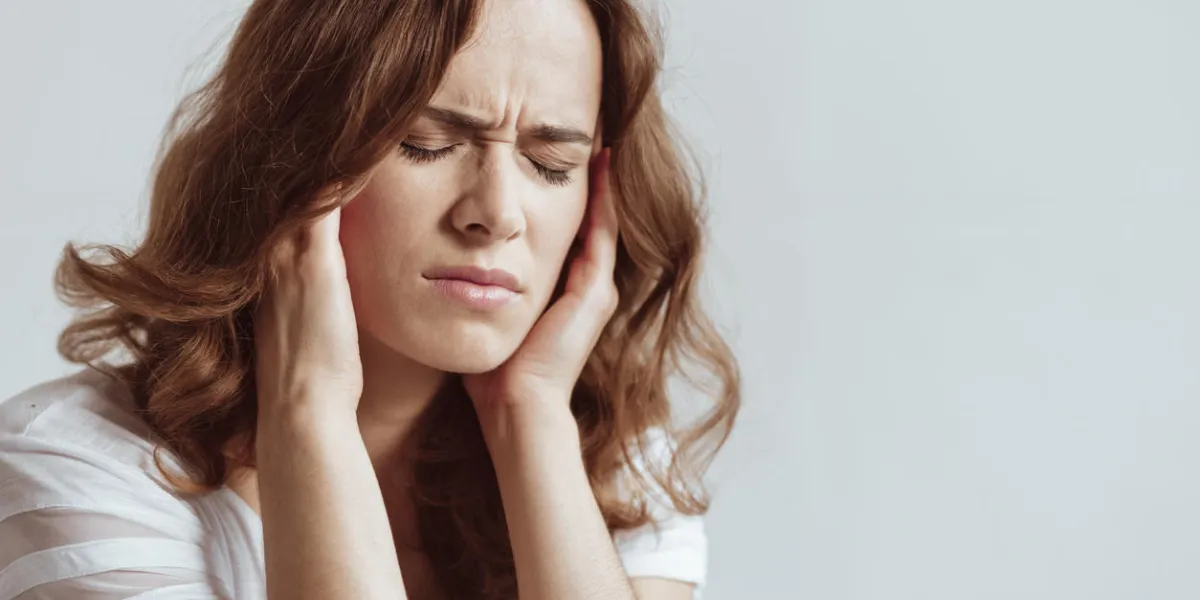 need to take some pills cannot stand this pain portrait of a mature brunette closing her eyes and pressing her temples while struggling with a headache