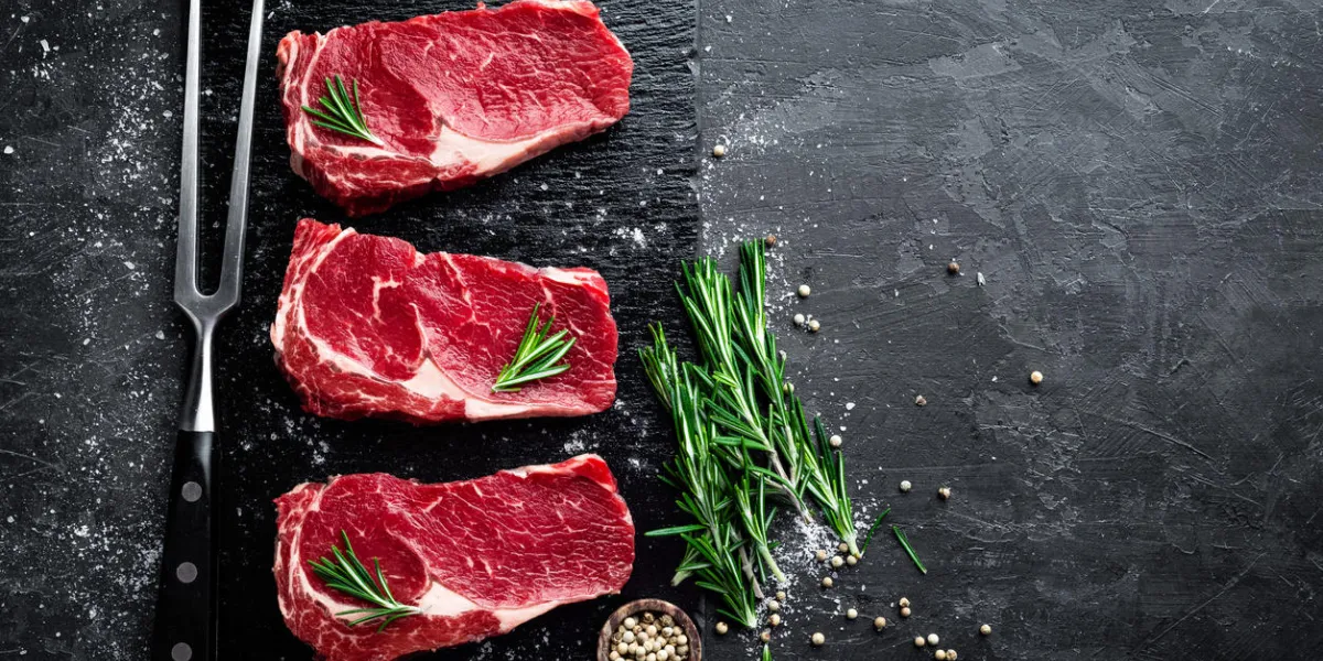 raw meat, beef steak on black background, top view raw meat, beef steak on black background, top view