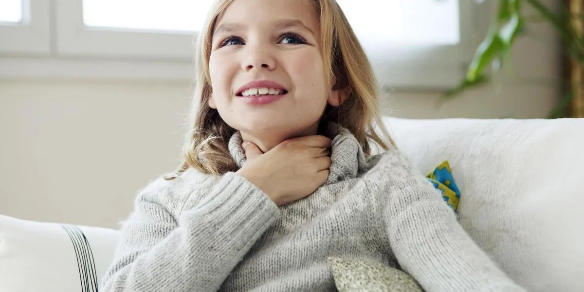child with sore throat child with sore throat