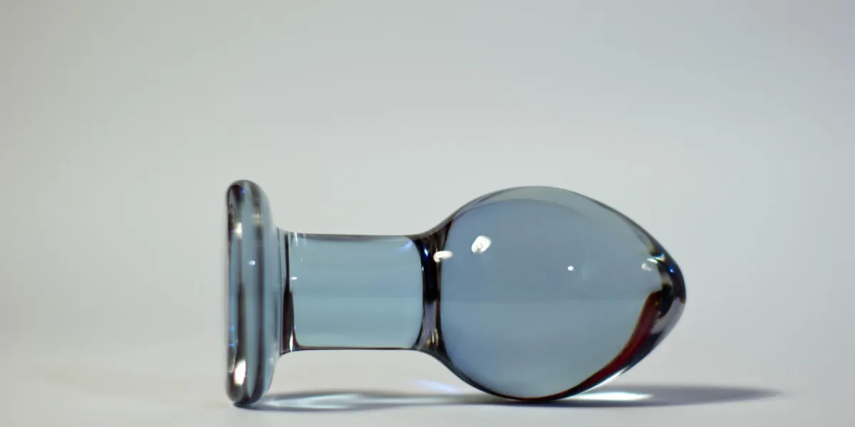 big butt plug transparent glass on a white background
