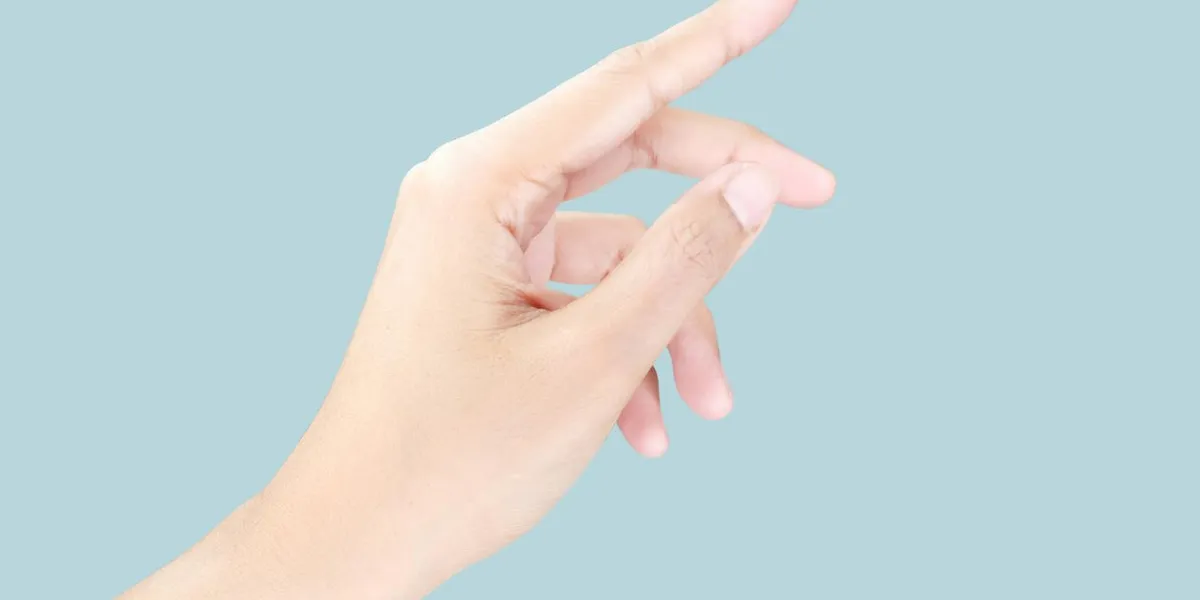 beautiful woman's hand, isolated on a blue pastel background