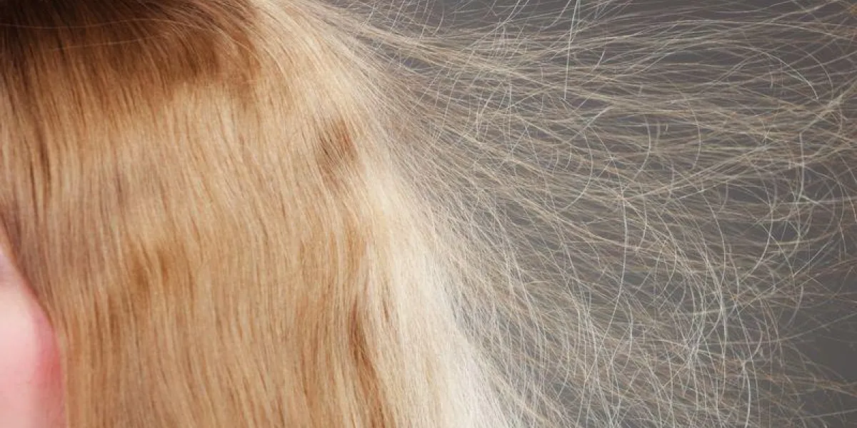 closeup of woman girl with static blonde long hair