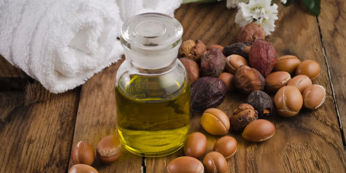 still life of argan oil with fruit on a natural background argan fruits come from morocco (africa) and are used as component of many cosmetic products still life of argan oil with fruit on a natural background argan fruits come from morocco (africa) and are used as component of many cosmetic products