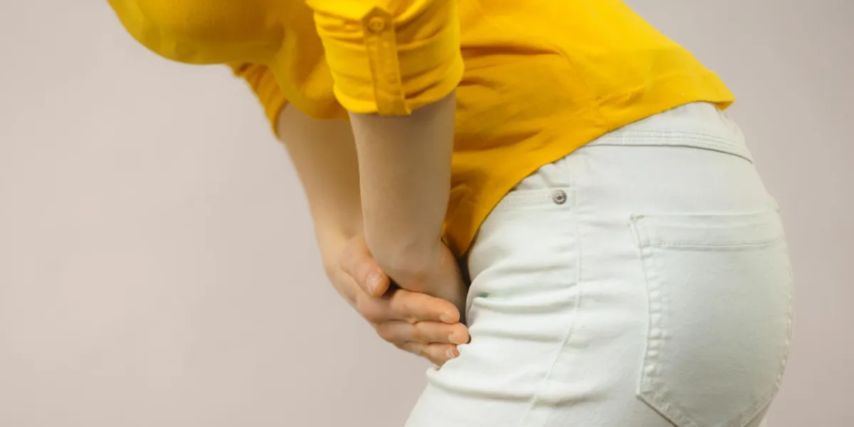 closeup young sick woman with hands holding pressing her crotch lower abdomen medical or gynecological problems, healthcare concept closeup young sick woman with hands holding pressing her crotch lower abdomen medical or gynecological problems, healthcare concept