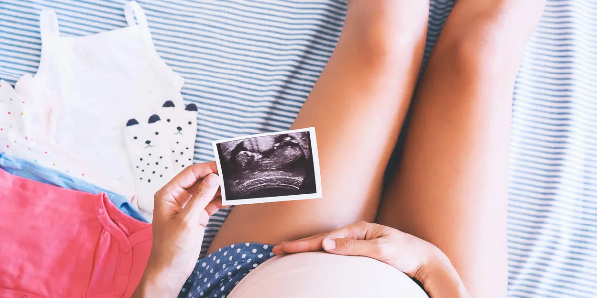 pregnant woman holding ultrasound image young mother waiting of the baby pregnant woman holding ultrasound image young mother waiting of the baby