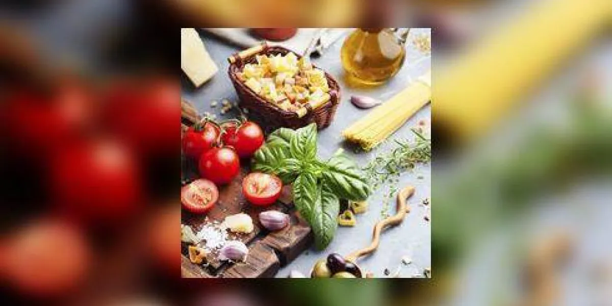 composition avec des pâtes crues, des légumes, de l'huile d'olive et des herbes