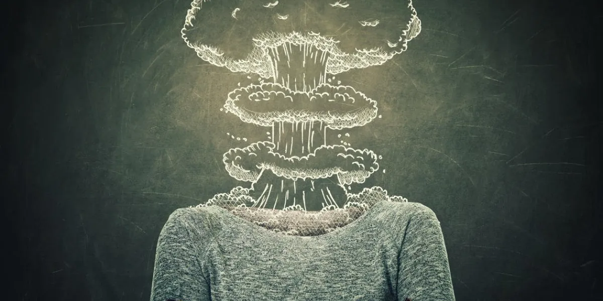 surreal image young woman head explosion over blackboard background mental state of human with lot of problems nervous person with crossed hands and a nuclear mushroom sketch, business failure