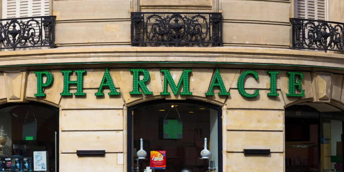 paris, france - 19th march 2014 the outside of a pharmacie in paris showing the sign and window display paris, france - 19th march 2014 the outside of a pharmacie in paris showing the sign and window display