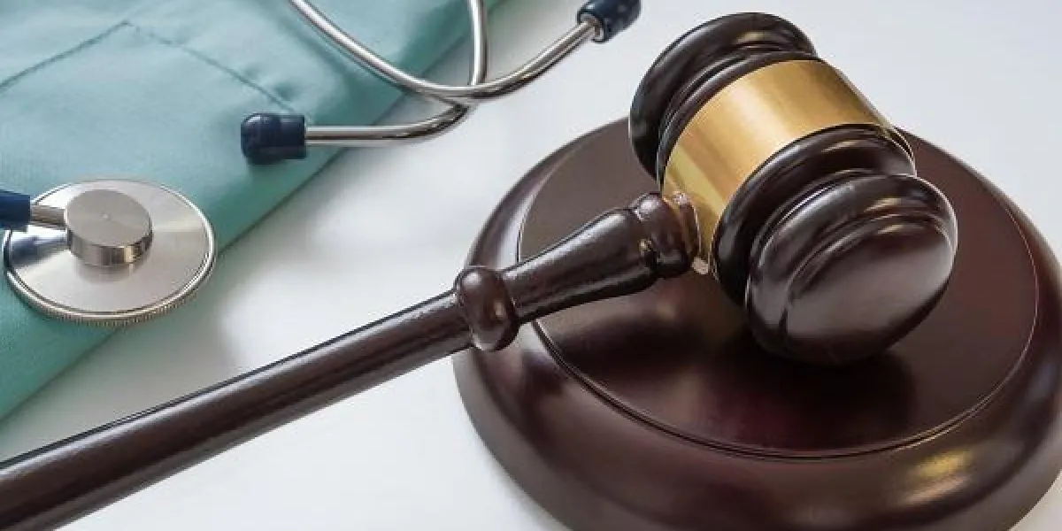 gavel and stethoscope in background medical laws and legal concept