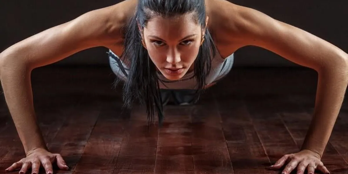 beautiful athletic woman pushed from the floor beautiful athletic woman pushed from the floor