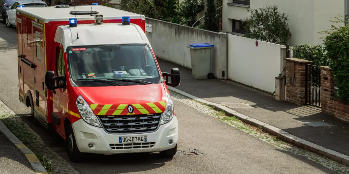 paris  french ambulance view from above on a tiny french parisian street