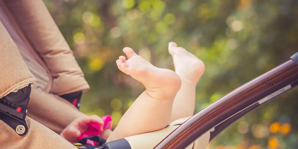 child is lie in a carriage