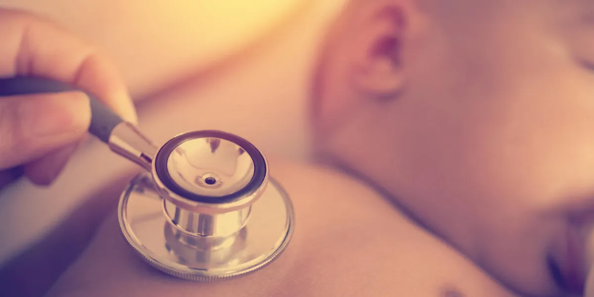 pediatric doctor exams newborn baby girl with stethoscope in hospital vintage style pediatric doctor exams newborn baby girl with stethoscope in hospital vintage style