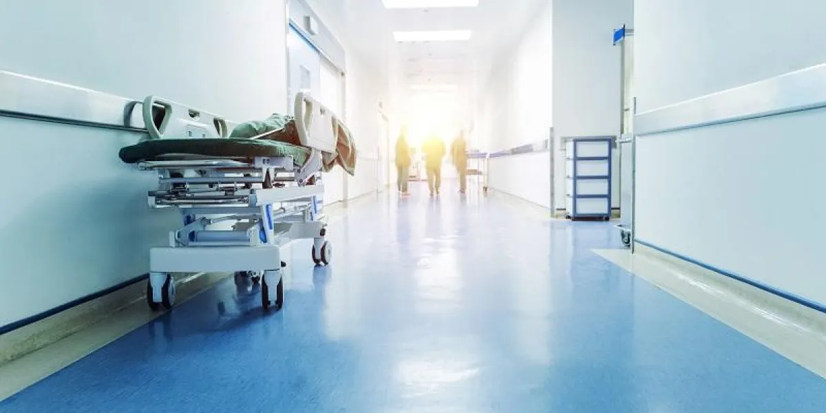 doctors and nurses walking in hospital hallway, blurred motion