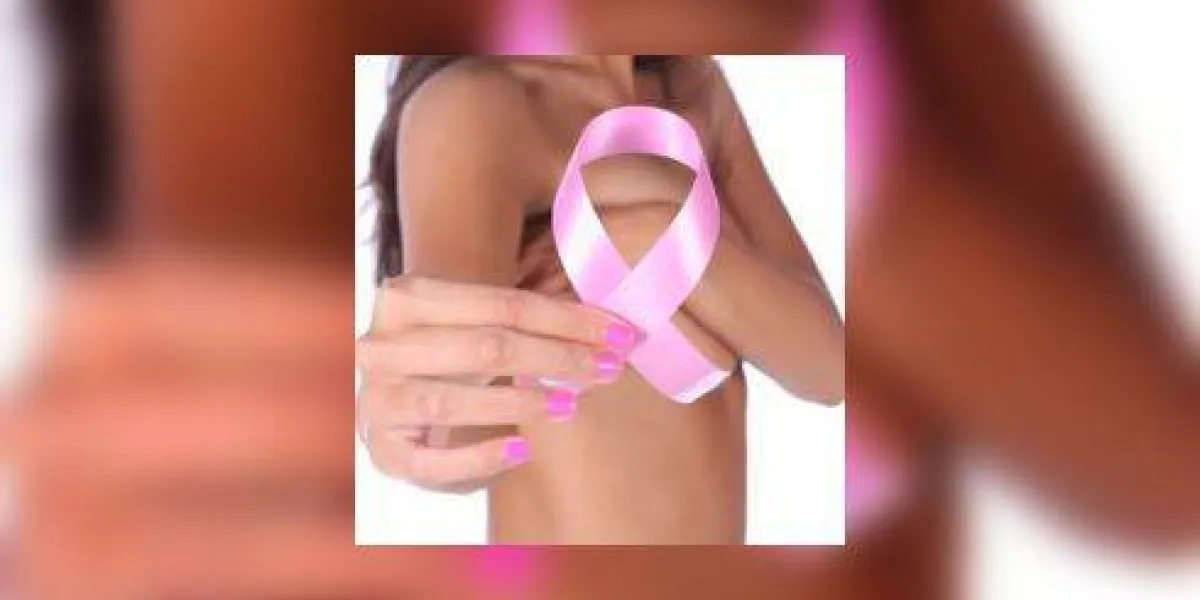 ruban de sensibilisation au cancer du sein rose en main ruban de sensibilisation au cancer du sein rose en main