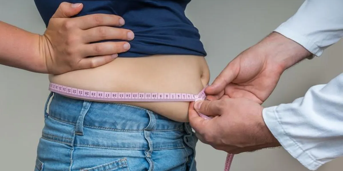 doctor treats a woman with overweight - obesity concept doctor treats a woman with overweight - obesity concept