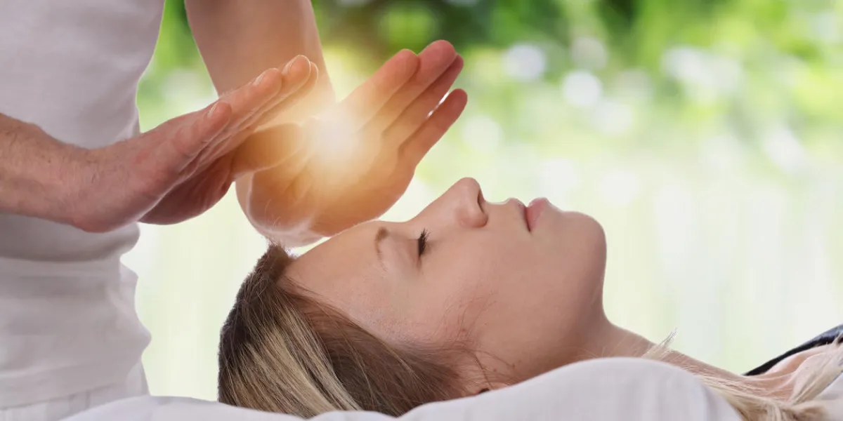 woman having reiki healing treatment , alternative medicine concept woman having reiki healing treatment , alternative medicine concept