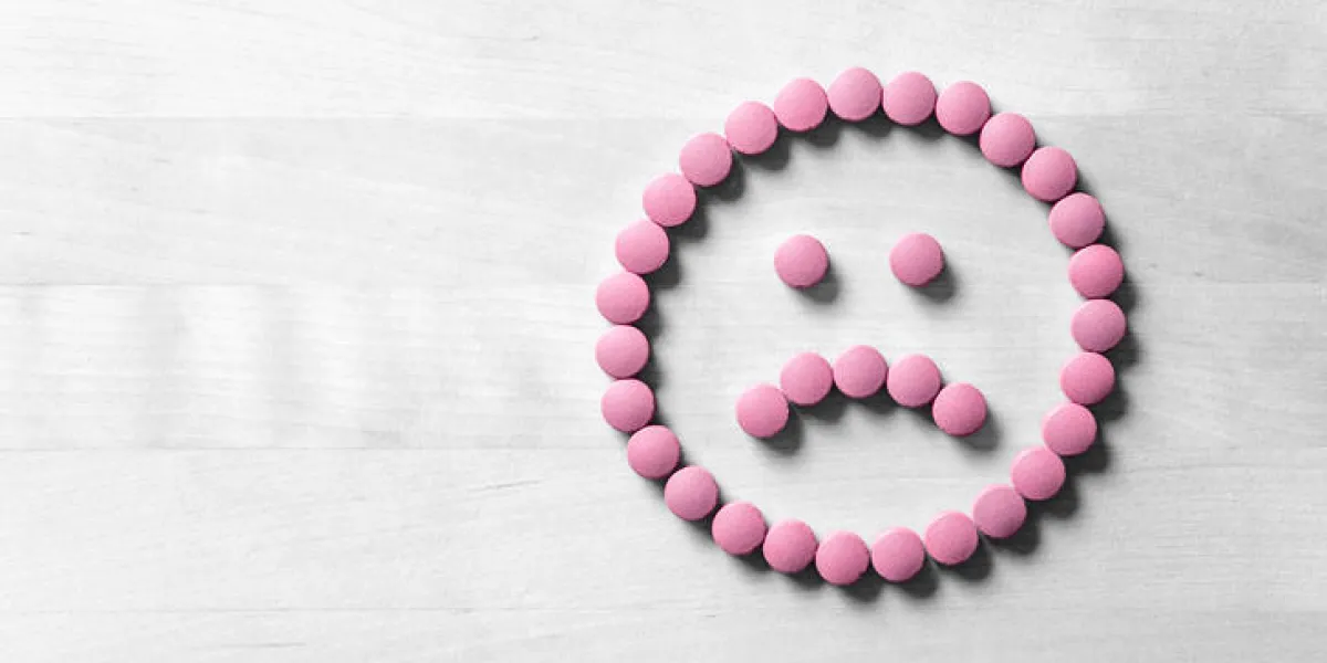 clinical depression, mental illness and disorder or bad health services concept sad smiley face made from pills, medicine and tablets on wooden table dissatisfied and unhappy icon clinical depression, mental illness and disorder or bad health services concept sad smiley face made from pills, medicine and tablets on wooden table dissatisfied and unhappy icon