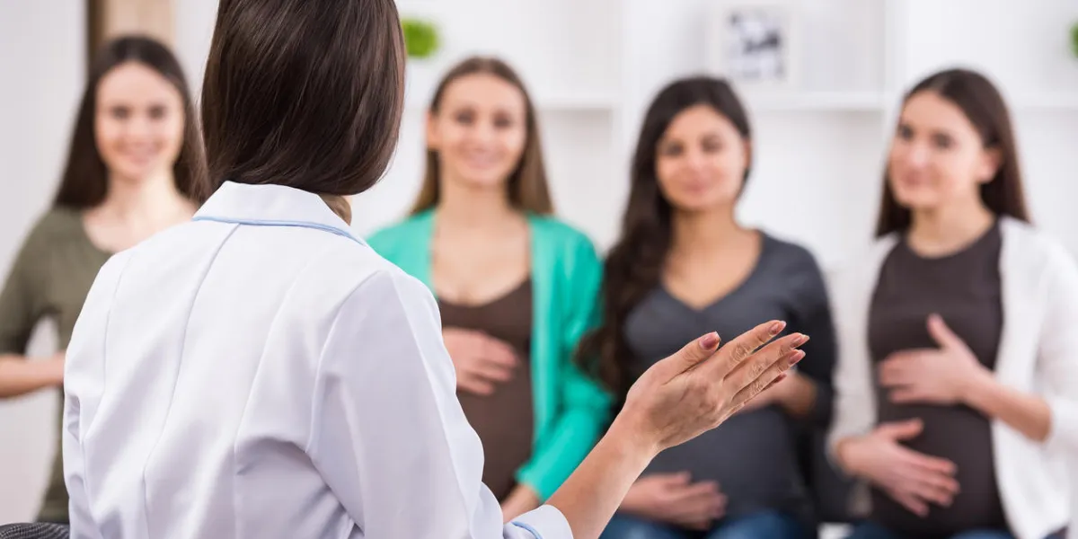 pregnant women are listening to doctor at antenatal class at the hospital