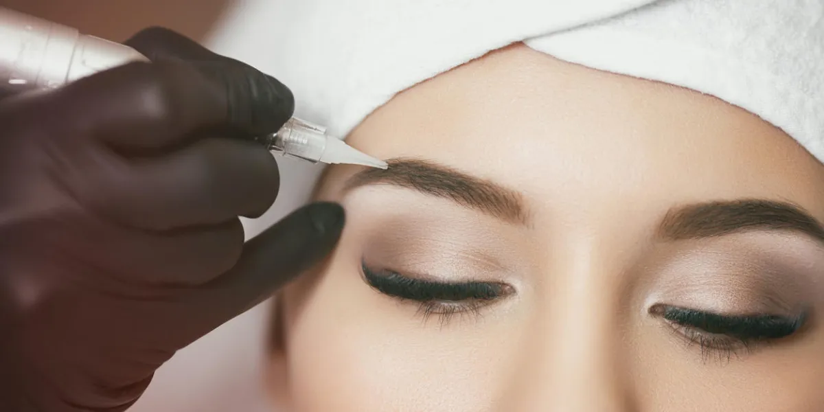 permanent makeup permanent tattooing of eyebrows cosmetologist applying permanent make up on eyebrows- eyebrow tattoo permanent makeup permanent tattooing of eyebrows cosmetologist applying permanent make up on eyebrows- eyebrow tattoo
