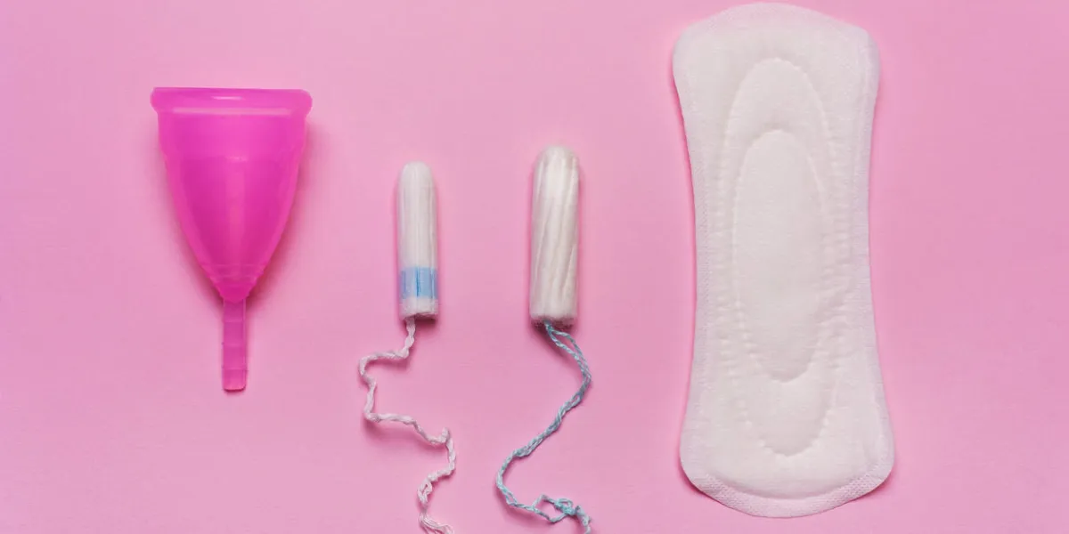 pad, menstrual cup, tampon on a pink background the view is flat concept of critical days, menstruation