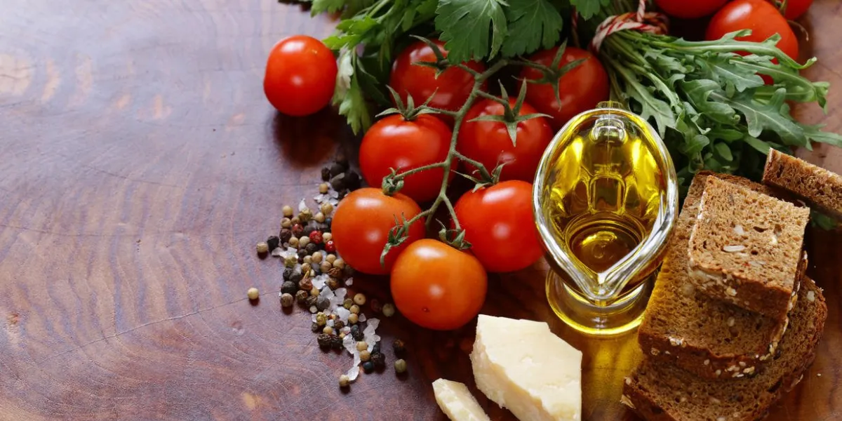 italian food ingredients - vegetables, olive oil, spices and pasta