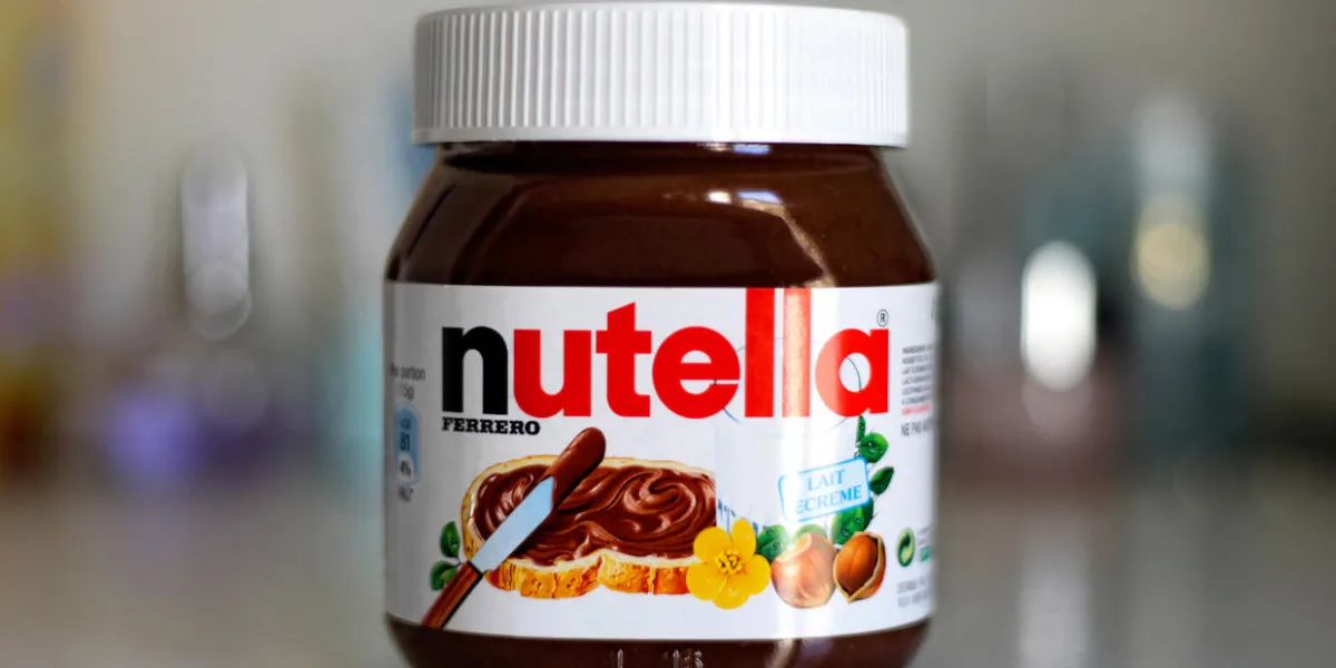 paris, france - february 22, 2012 jar of nutella hazelnut on a bokeh background nutella is the brand name of a chocolate hazelnut flavored sweet spread by the italian company ferrero paris, france - february 22, 2012 jar of nutella hazelnut on a bokeh background nutella is the brand name of a chocolate hazelnut flavored sweet spread by the italian company ferrero