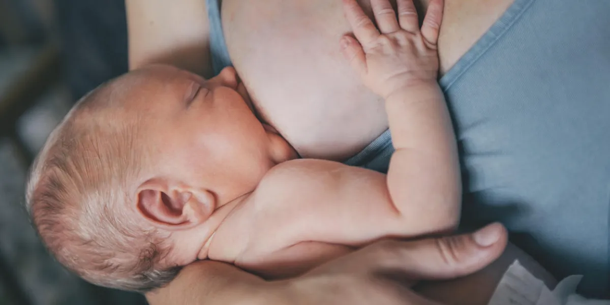 mother breastfeeding her newborn baby boy mom nursing small kid mother breastfeeding her newborn baby boy mom nursing small kid