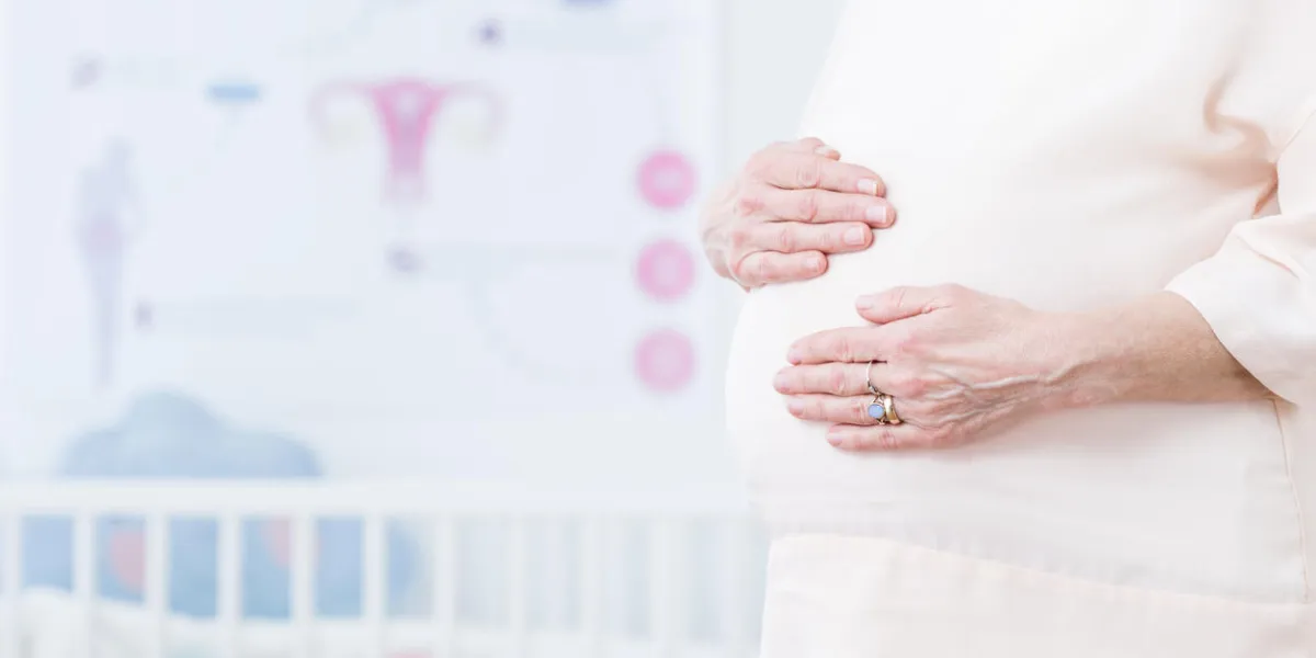 close-up of future mother stoking her pregnancy belly with love