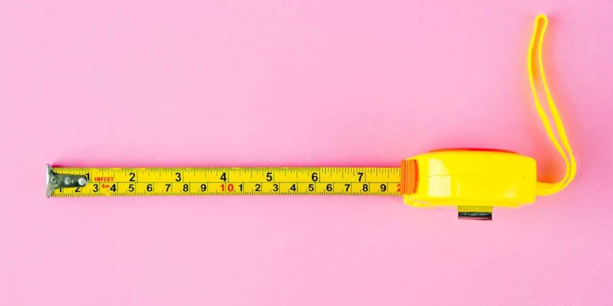 measuring tape on pink background measuring tape on pink background