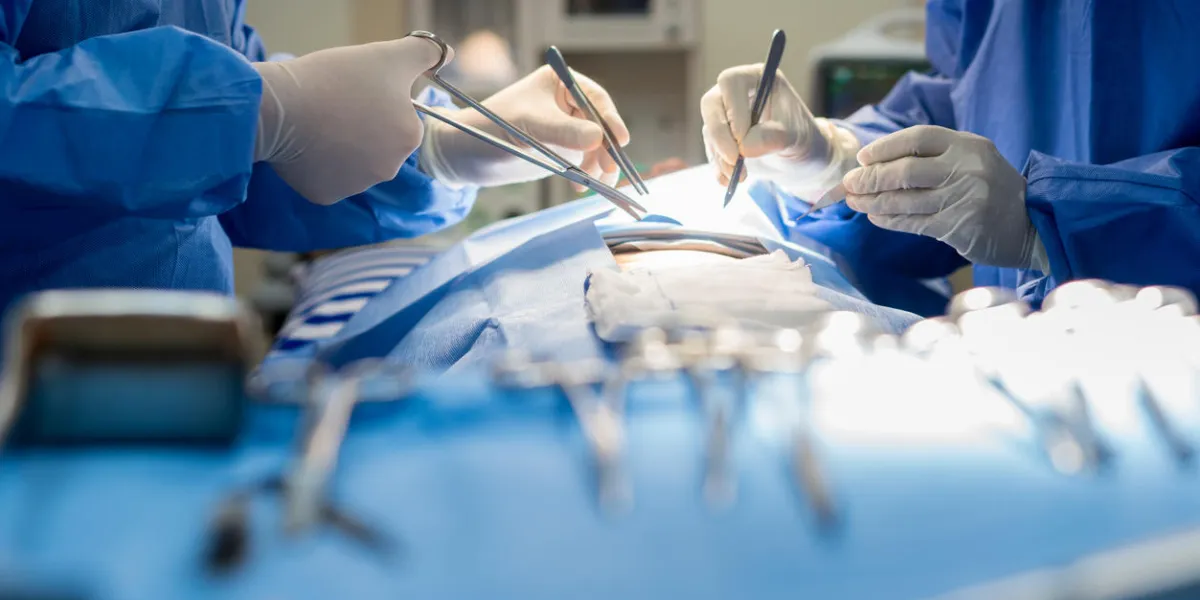 asian doctor and an assistant in the operating room for surgical venous vascular surgery clinic in hospital