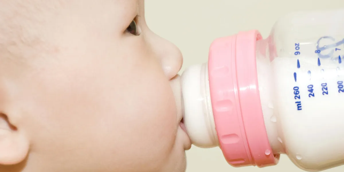 baby drinking bottle milk