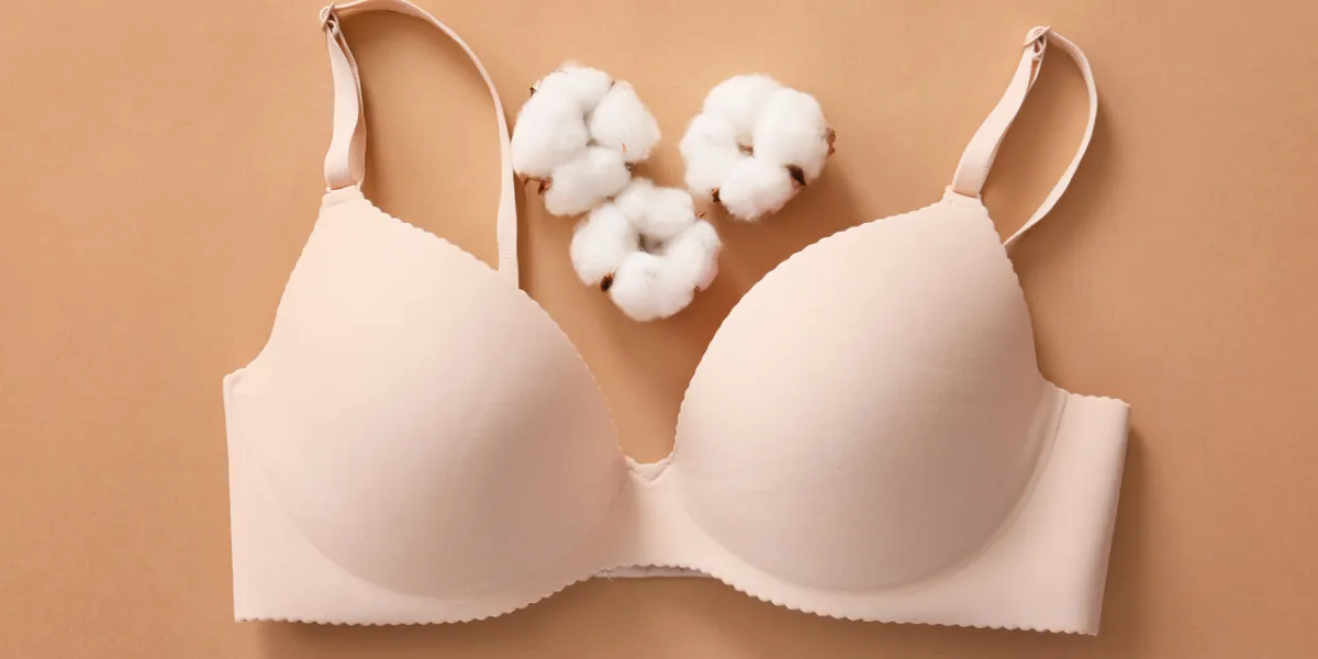 cotton bra on color background