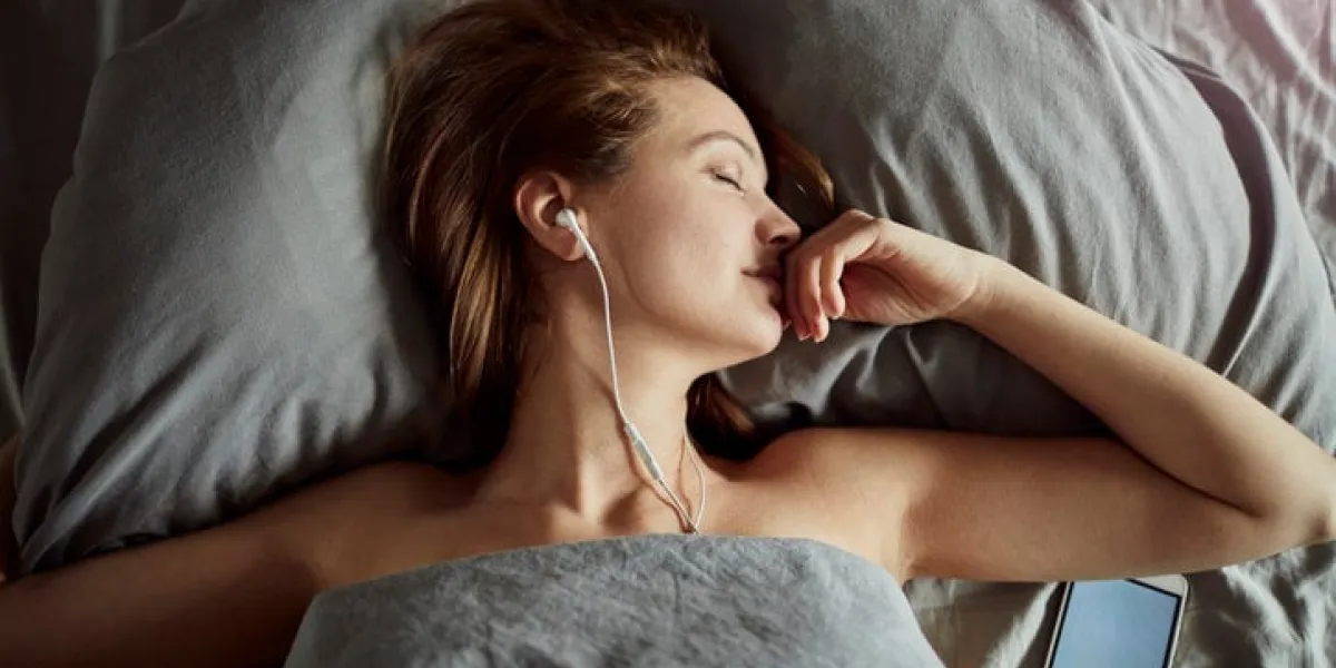 close up of a young lady resting while listening to music close up of a young lady resting while listening to music