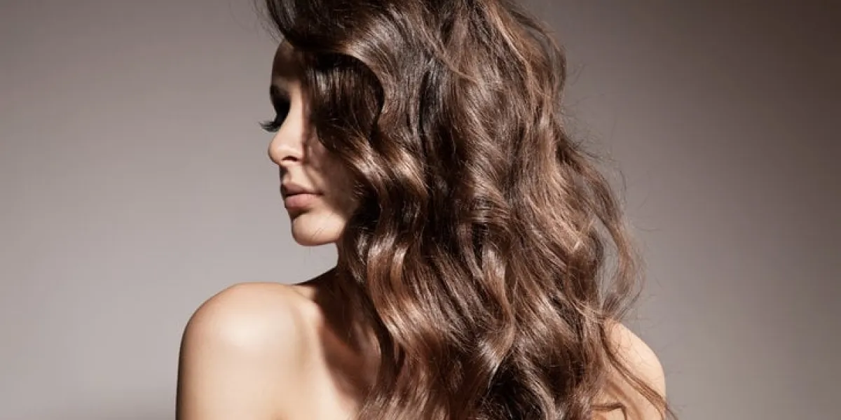 beautiful brunette woman curly long hair