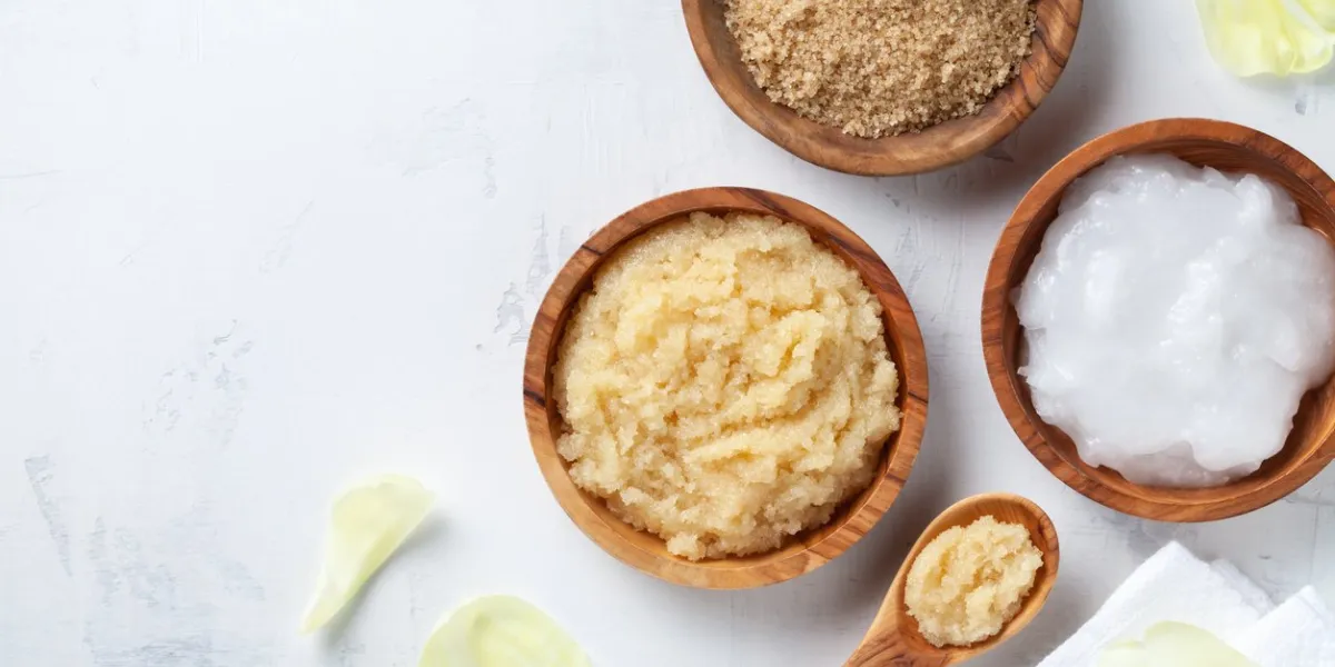 sugar body scrub with ingredients on white stone table homemade cosmetic for spa and beauty with copy space
