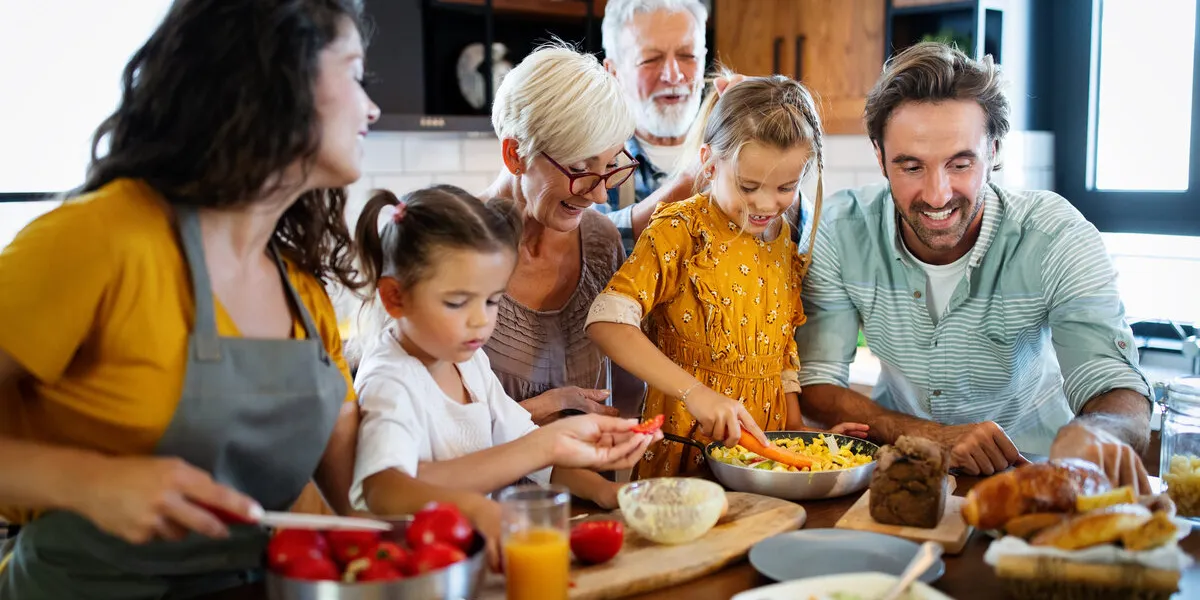 cheerful happy family spending good time together while cooking in kitchen cheerful happy family spending good time together while cooking in kitchen