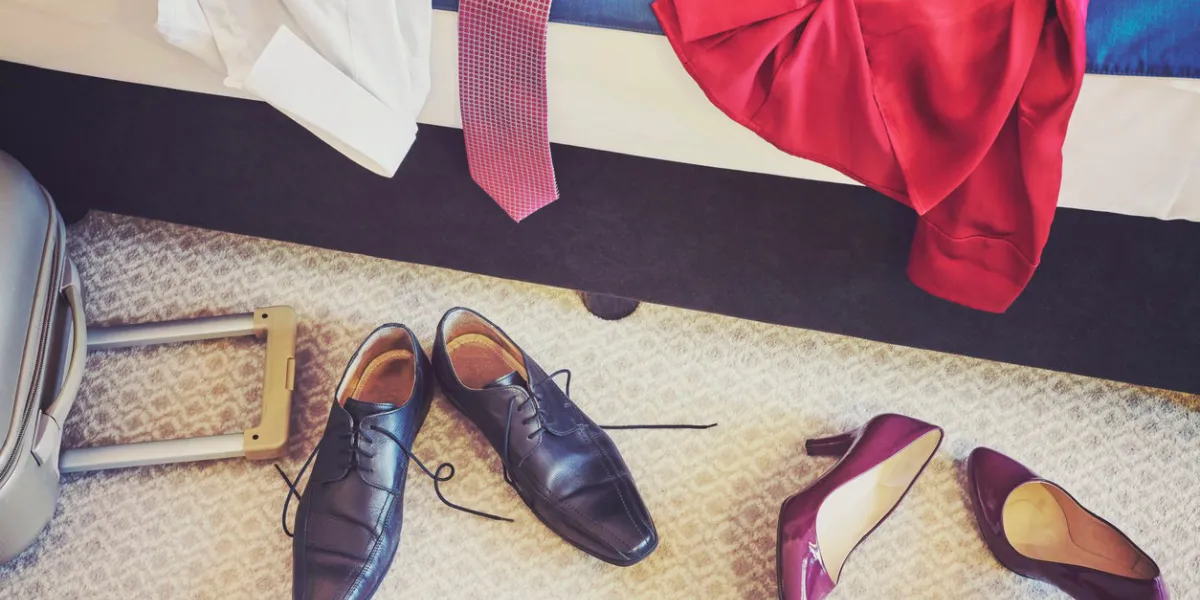 female and man footwear and clothing in a hotel room, vintage toned conceptual picture female and man footwear and clothing in a hotel room, vintage toned conceptual picture